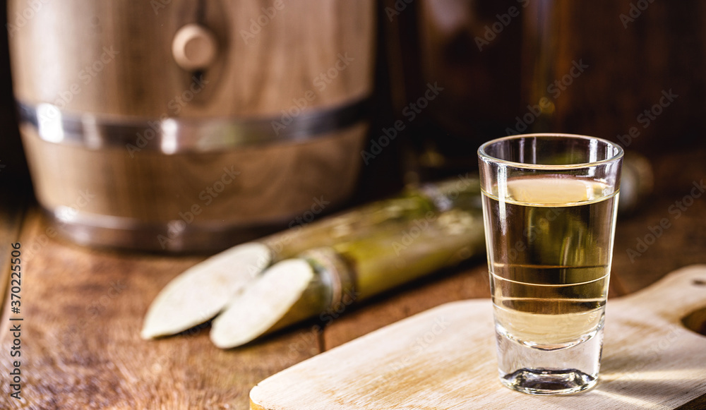 Fotografia do Stock: Brazilian drink known as Cachaça, "pinga", cane or  distilled sugar cane. Name given to cognac produced in Brazil. It is used  in the preparation of the caipirinha known worldwide.