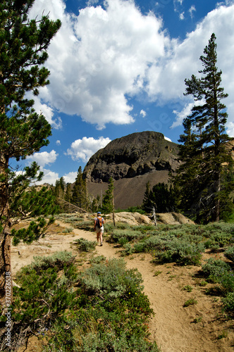 Women hiker heading toward Ebbetts Peak on the Pacific Crest Trail, Sierra Nevada Mountains, California photo