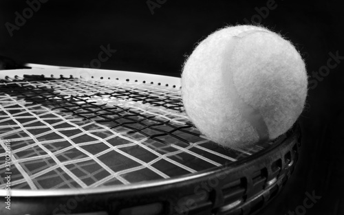 Tennis Ball and Racket in black and white.