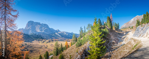 Panorama over Dolomites at between Three Peaks  Tre Cime  Drei Zinnen  and Fanes-Sennes-Prags National Parks during sunset and golden Autumn  South Tyrol  Italy  sunny day