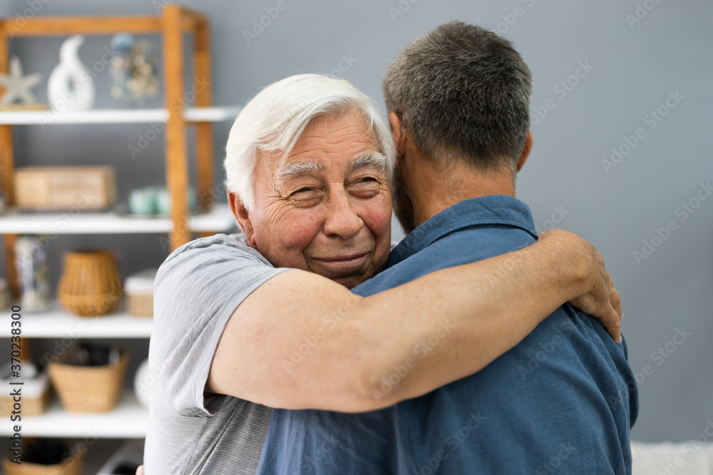 Son Hugging His Happy Senior Father Son Hugging His Happy Senior Father