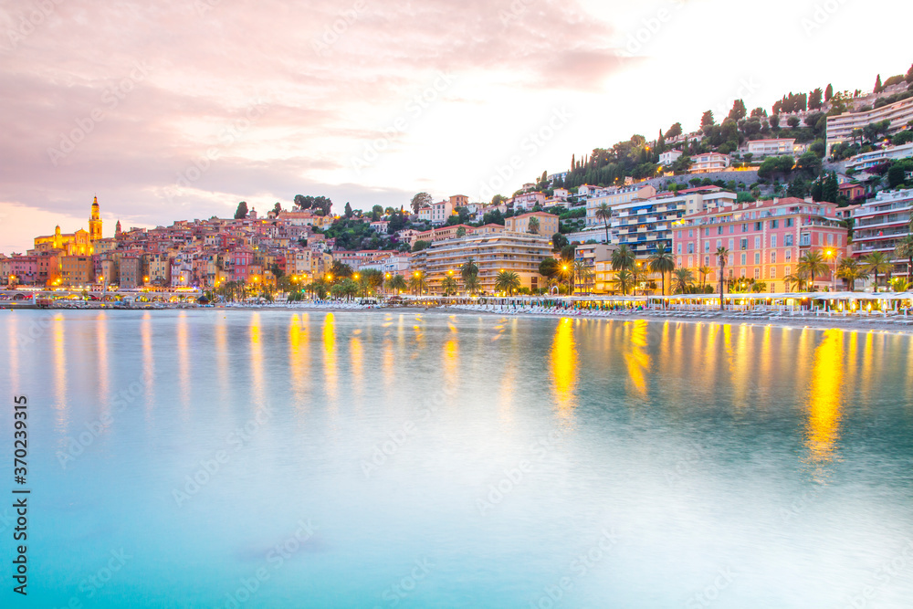 Naklejka premium Menton mediaeval town on the French Riviera in the Mediterranean during sunset, France.