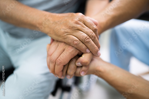 Fototapeta Naklejka Na Ścianę i Meble -  Elder Patient Helping Nurse Hand