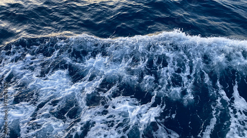 Seawater Ocean surface, sea foam on the blue ocean, background.