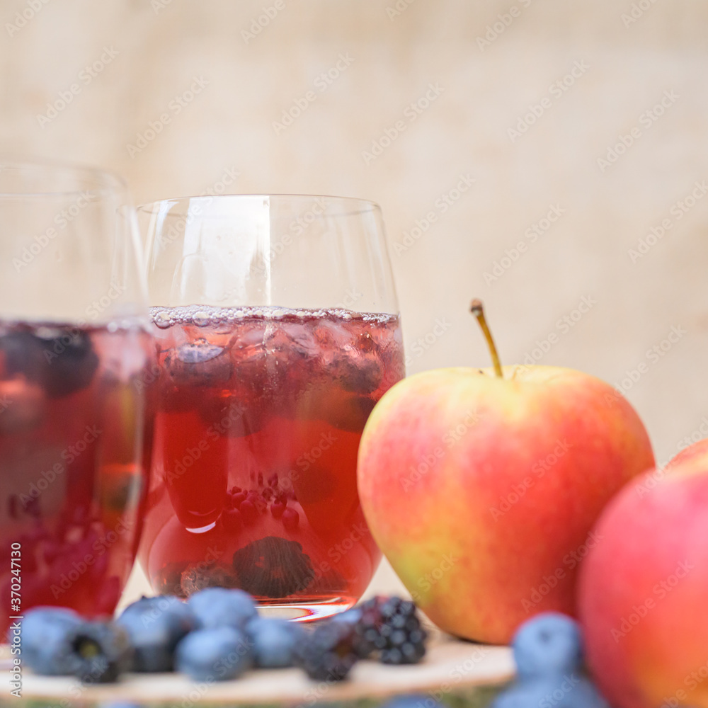 delicious red berries Cocktail with blueberries in front of a blurred brown background delicious red berries Cocktail with blueberries in front of a blurred brown background