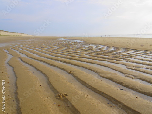  Ebb in Atlantic ocean coast. Hourtin, Aquitaine, France. Sand beach.