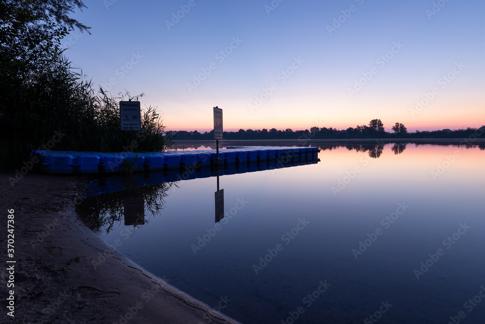 sunrise over the lake with calm water