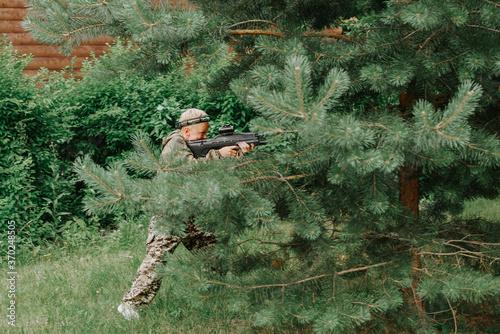Man playing in lasertag shooting game, man with a gun, war simulation.