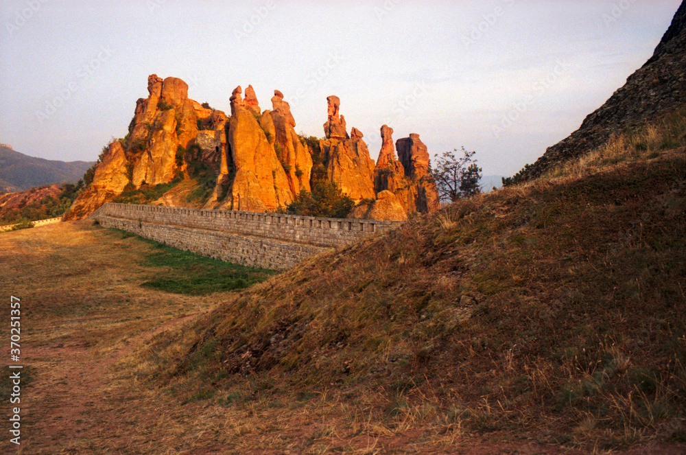 Belogradchik fortress at sunset in the mountains. The real grain of the scanned film.