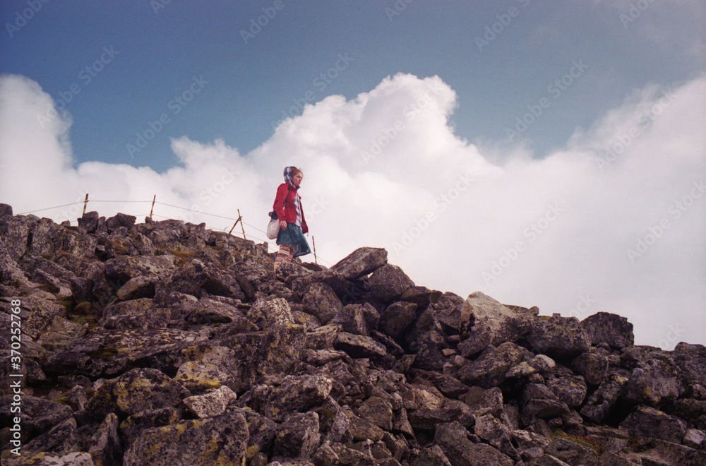 Young Caucasian woman traveling in the mountains of Bulgaria. Near Mount Vihren.  Real grain of scanned film