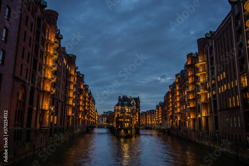 The Warehouse District (Speicherstadt) in Hamburg, Germany. View of Wandrahmsfleet. The largest warehouse district in the world is located in the port of Hamburg within the HafenCity quarter.