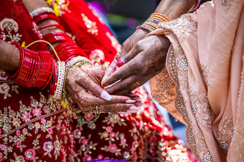 Indian Hindu wedding ceremony ritual items, hands and decorations close up