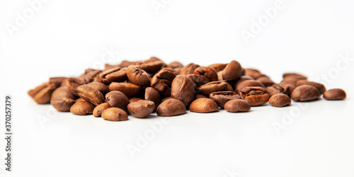Group of coffee beans isolated on white background. Selective focus.