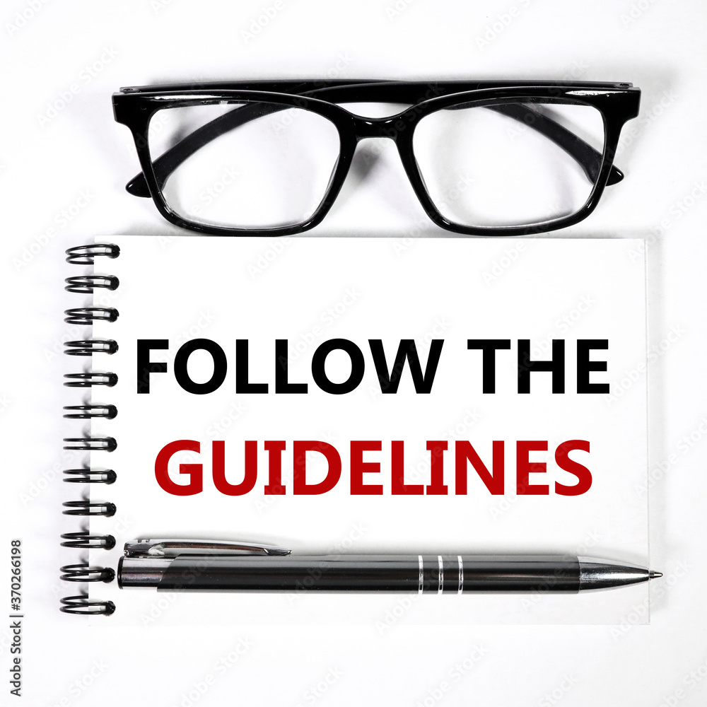 FOLLOW THE GUIDELINES. text on white paper on white background FOLLOW THE GUIDELINES. text on white paper on white background