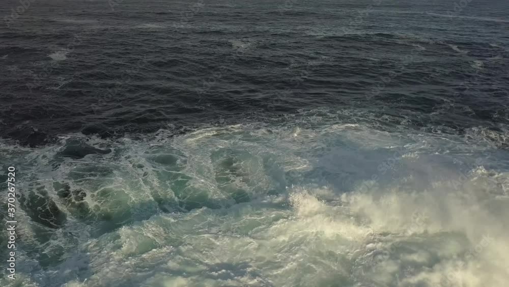 Aerial of Waves Rolling and Crashing Over Volcanic Rock Formations Azores