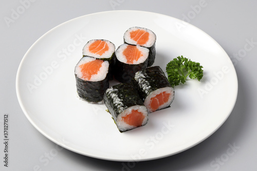 Salmon sushi maki roll isolated on white background