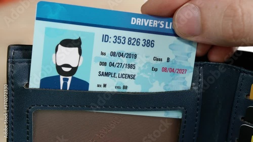 Man showing driving license, closeup photo