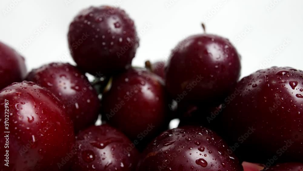 Sweet ripe plums with water drops, closeup Sweet ripe plums with water drops, closeup