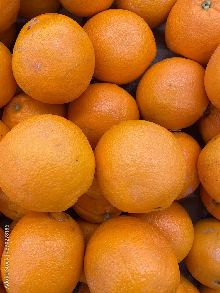 Mandarin orange in supermarket. Bunch of fresh mandarin oranges on market. Mandarin orange in supermarket. Bunch of fresh mandarin oranges on market.