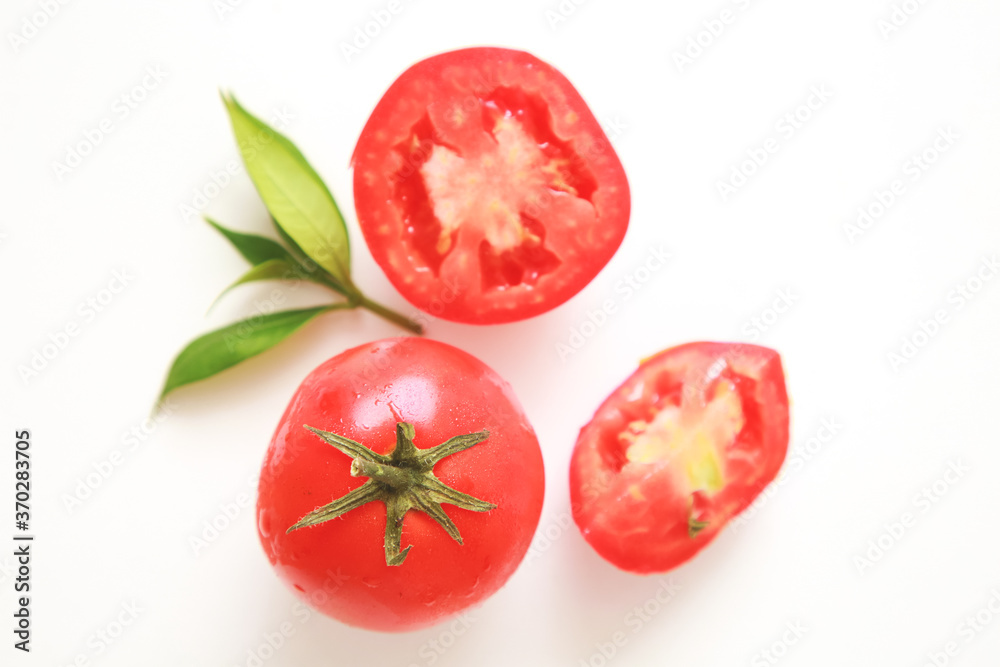 Tomatoes and slices on white background. Tomatoes and slices on white background.
