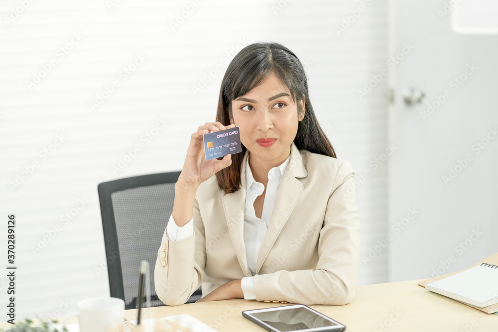 Asian woman holding credit card. Online Shopping, internet banking, spending money Concept