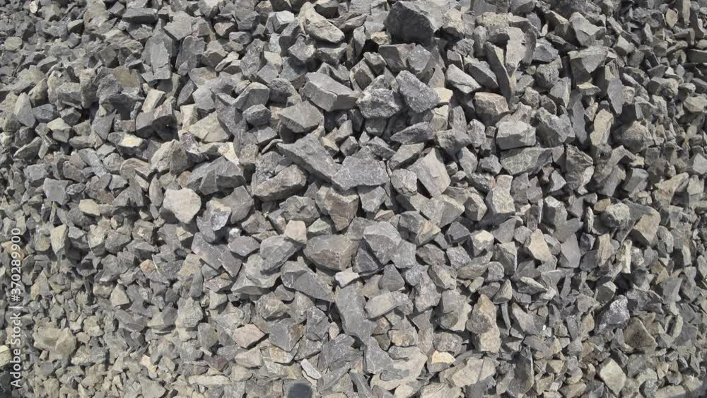 Moving stones. Lumps of gray rock are moving. View from above.
Moving stones. Lumps of gray rock are moving. View from above.