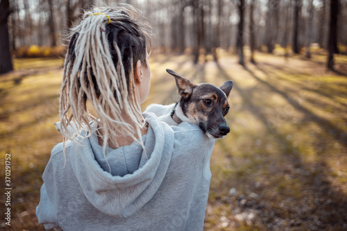 Girl's training a dog in the park.