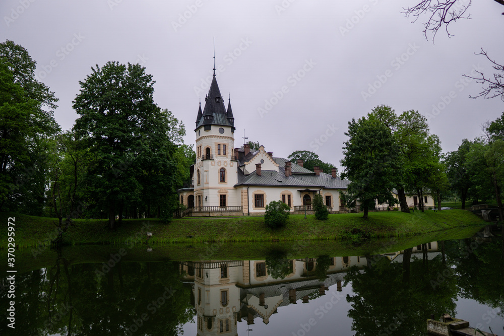 Palace in Olszanica reflected in the water, Bieszczady, Poland