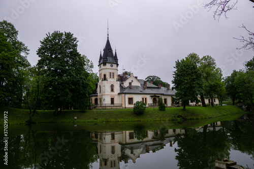 Palace in Olszanica reflected in the water, Bieszczady, Poland