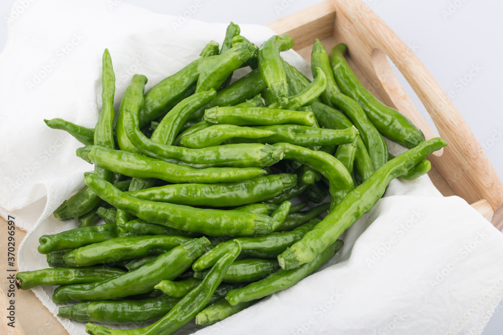 Green Organic Shishito Peppers in a bunch. Green Organic Shishito Peppers in a bunch.