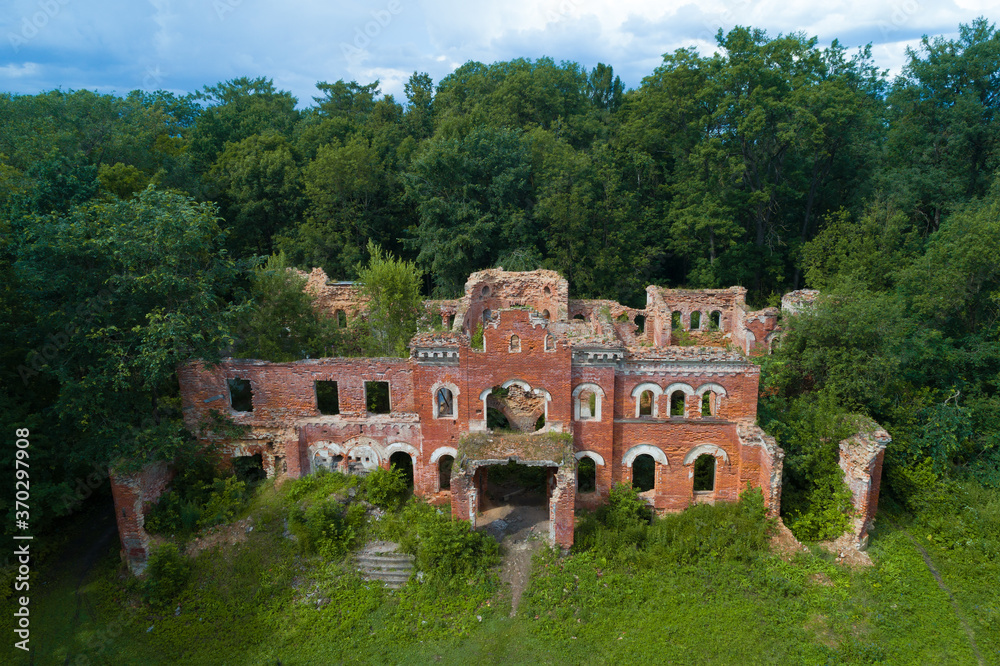 Ruins of ancient house in the estate of the barons of Vrangel on a July afternoon (shot from a quadcopter). Torosovo. Leningrad region, Russia