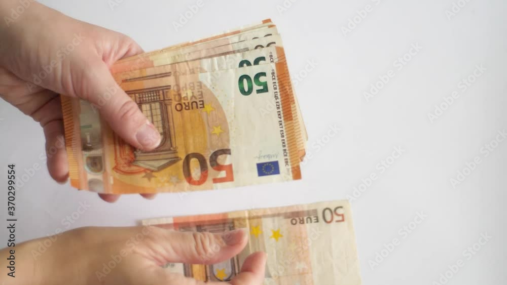 White caucasian woman counting euro money banknotes White caucasian woman counting euro money banknotes