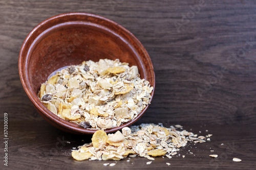 a pile of muesli so close, wooden background