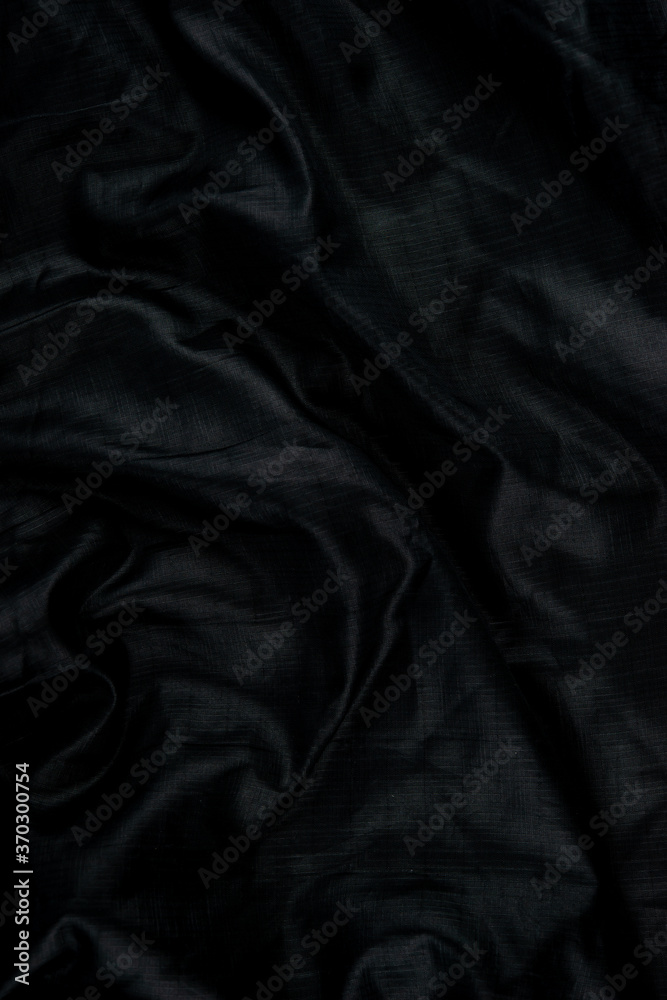 Black abstract background cloth and luxury liquid waves silk texture satin material Black abstract background cloth and luxury liquid waves silk texture satin material