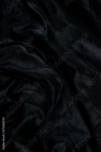 Black abstract background cloth and luxury liquid waves  silk texture satin material