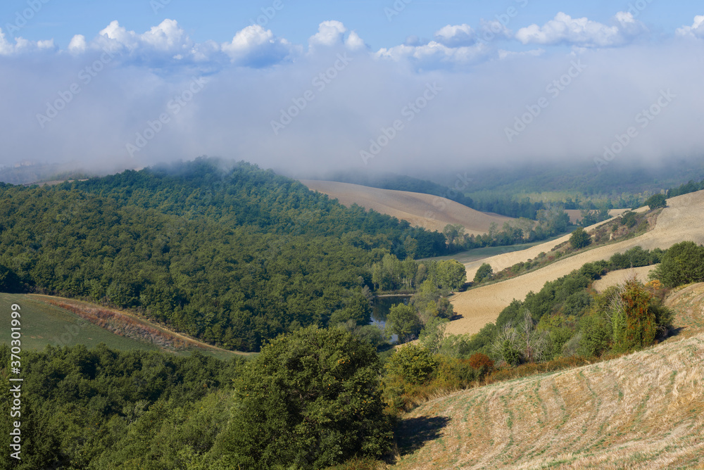 Morning fog on the hills of September Tuscany. Italy