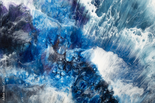 Alcohol ink water. Marble texture. Blue ocean wave with white bubble foam effect. Crystal streak surface. Natural art background. Fantasy undersea abstract design.