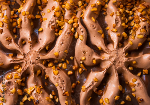 Top view of  chocolate icecream background with nuts.