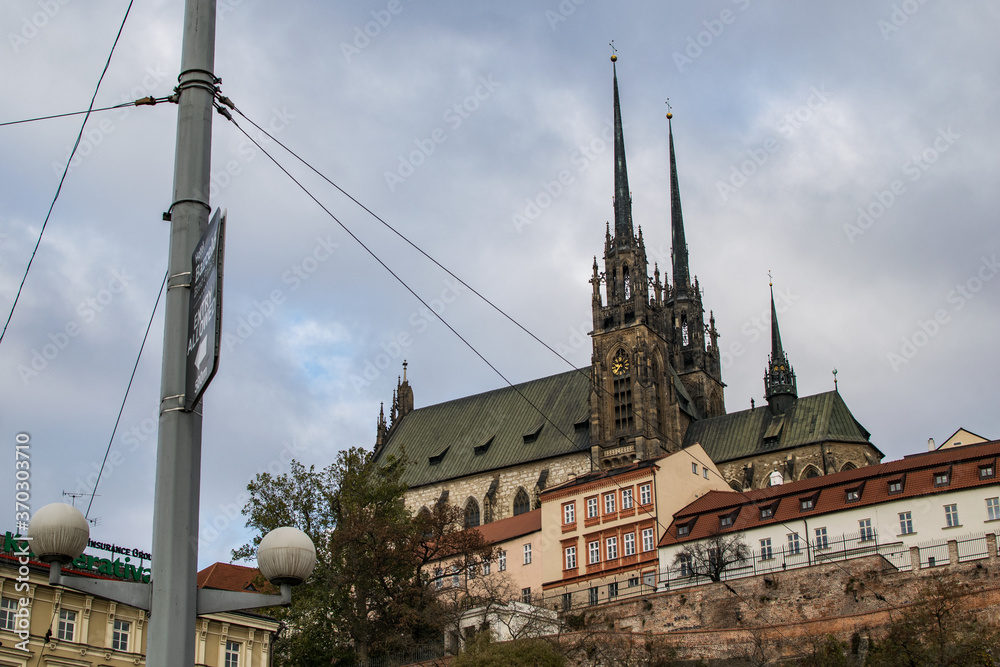 Obraz premium old antique cathedral contrast with new city power line