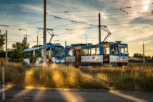 Photography two tram drivers taking break trams in yellow sunset