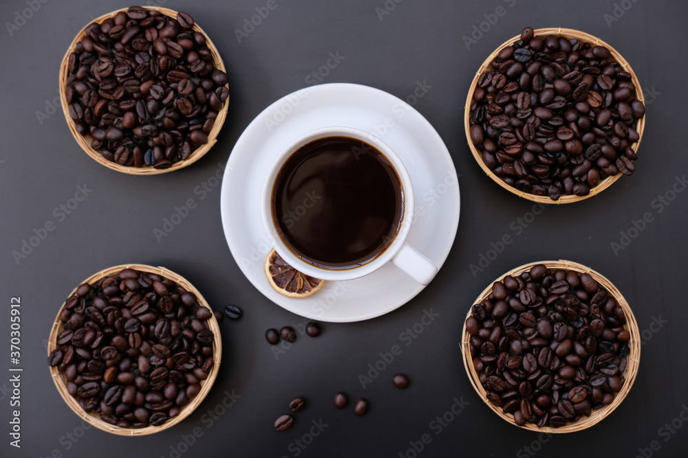 coffee cup and coffee beans on old wood table background coffee cup and coffee beans on old wood table background
