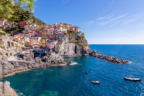 Wonderful aerial view of the famous Cinque Terre seaside village of Manarola, Liguria, Italy, on a sunny summer day