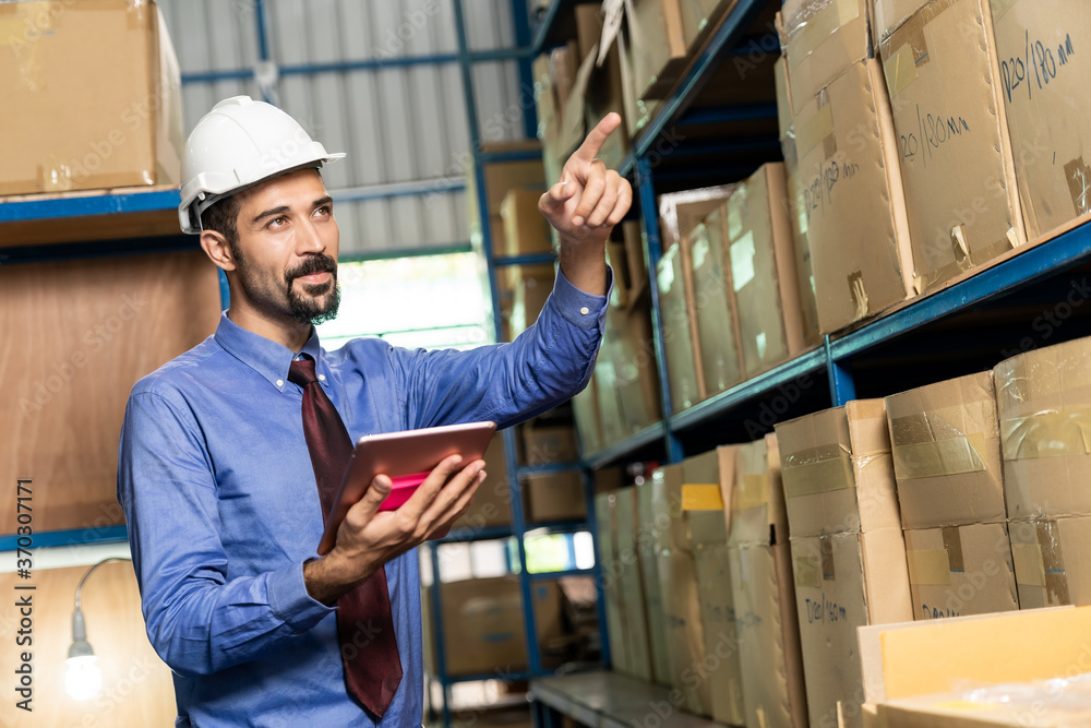 Middle east warehouse manager using tablet do inventory Middle east warehouse manager using tablet do inventory