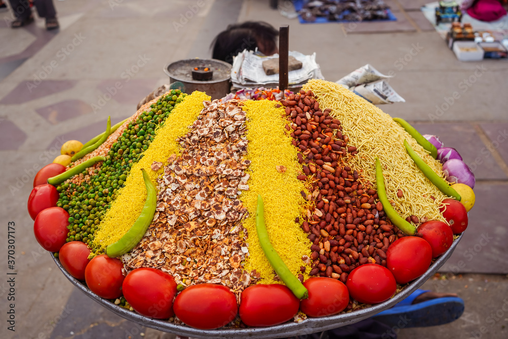 Colorful street stall with ingredients to make popular snack in India