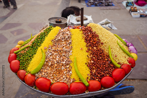 Obraz na płótnie Colorful street stall with ingredients to make popular snack in India w salonie
