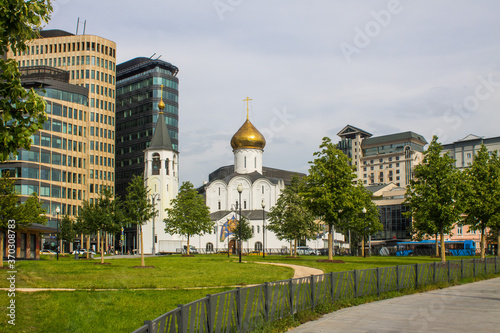 Church of St. Nicholas at Tverskaya Zastava and modern business center on a cloudy summer day and space for copying in Moscow Russia