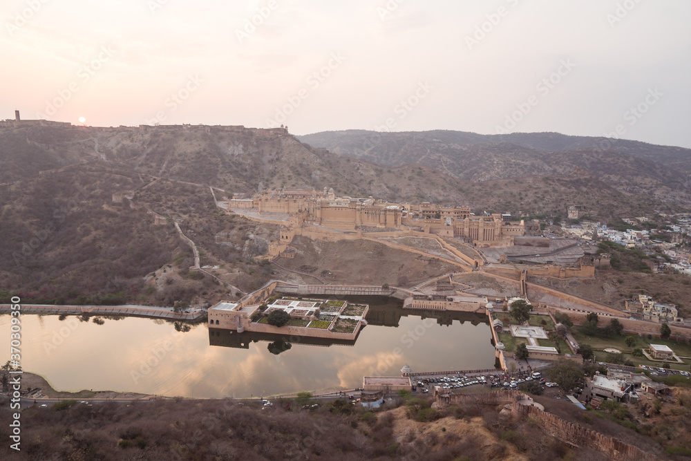 Scenic landscape of Amber Fort and lake during sunset