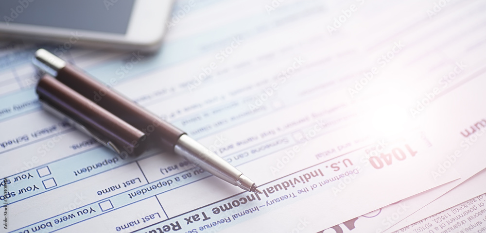 Annual tax reporting. Tax form on the table. Financial statements for signature. Annual tax reporting. Tax form on the table. Financial statements for signature.