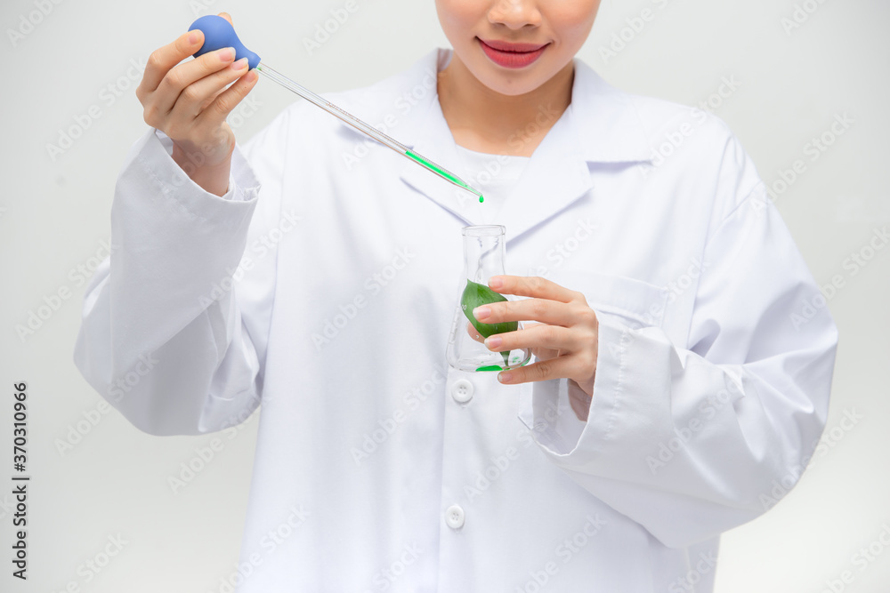 Candid shot of beautiful young Asian female researcher conducting experiment in laboratory, Candid shot of beautiful young Asian female researcher conducting experiment in laboratory,