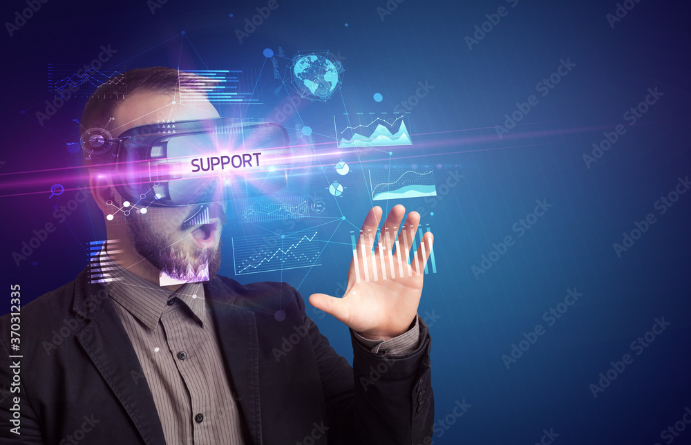 Businessman looking through Virtual Reality glasses with SUPPORT inscription, new business concept Businessman looking through Virtual Reality glasses with SUPPORT inscription, new business concept